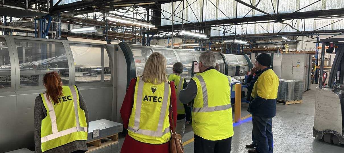 ATEC group training organisation staff viewing machinery at B&R Enclosures