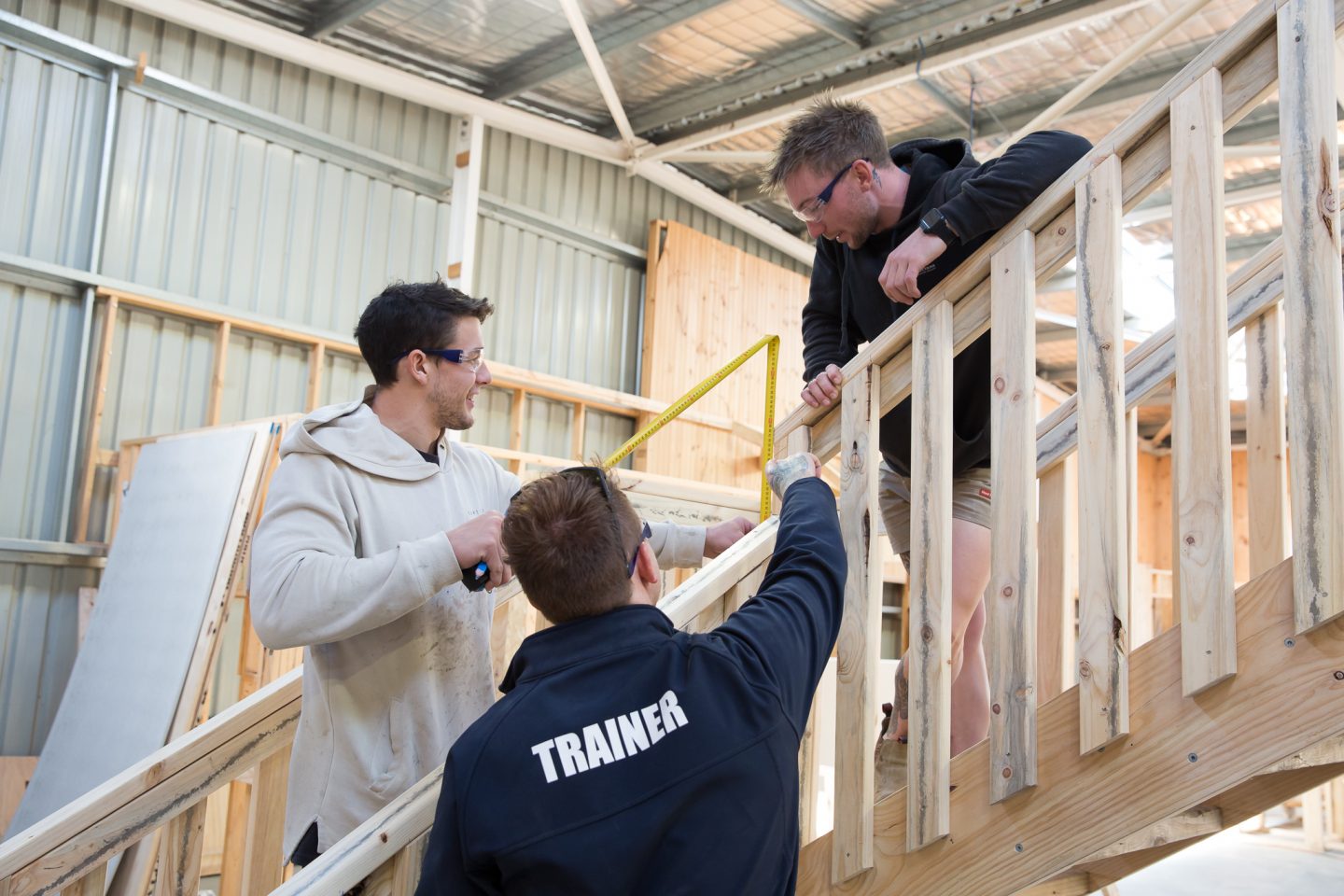 Carpentry trade trainer with students.